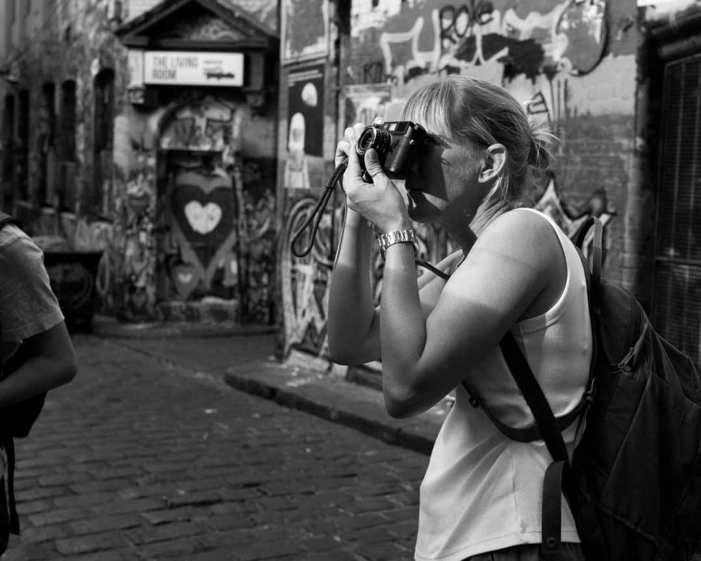 black & white portrait of a young woman shooting film in melbourne learn how to develop & print film in melbourne