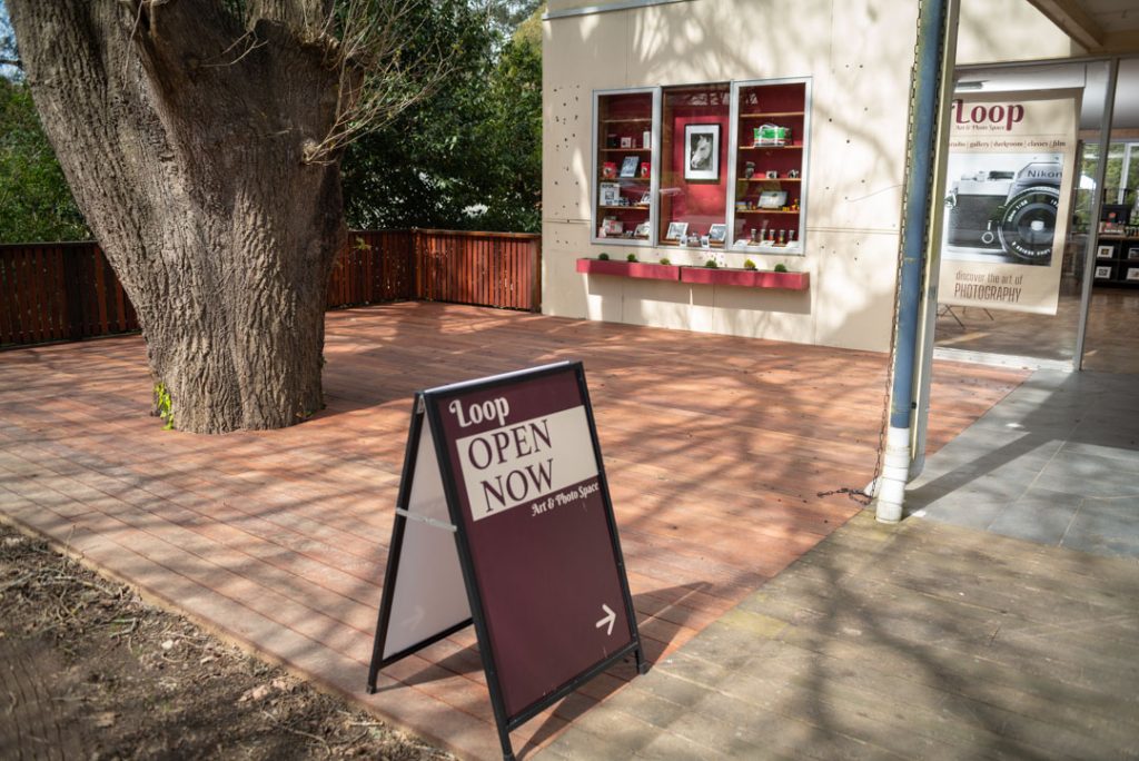 the deck space out front of the camera & photo shop in olinda, victoria